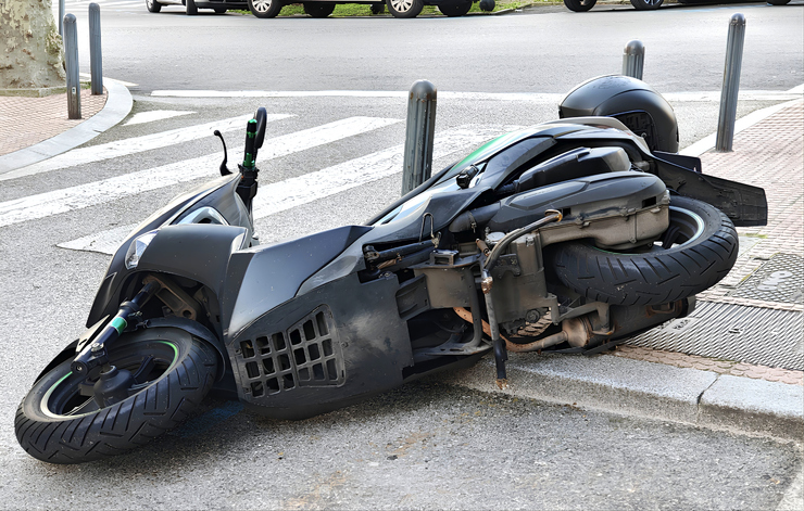 motorcycle tipped over on street after crash - Marietta motorcycle accident attorney