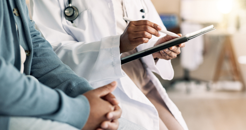 doctor consulting a patient using an iPad - Marietta medical malpractice attorney