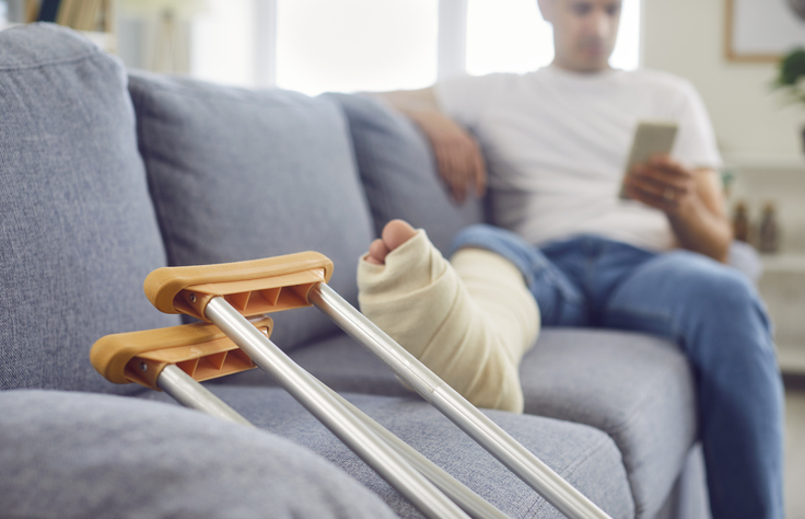 Person with injured leg using phone while sitting on a couch - Can I claim personal injury if it was my fault?