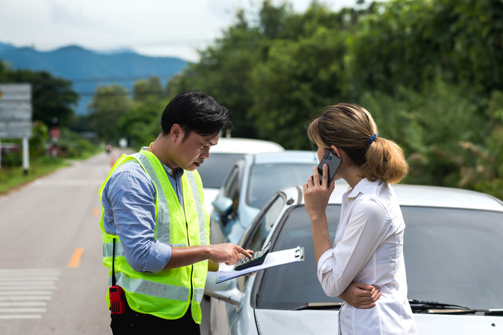 Woman making a phone call after car accident - can the at-fault driver sue me after an accident?